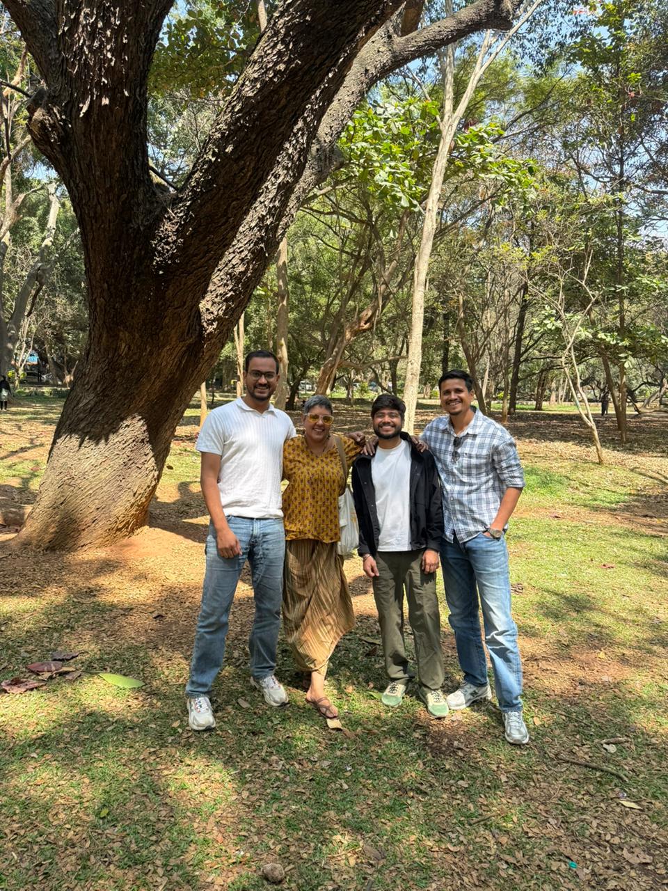 The Bangalore Kabir Festival team together outdoors under a tree